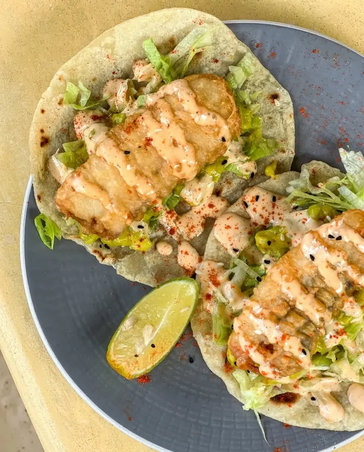 Battered fish tacos with chipotle mayo and lime