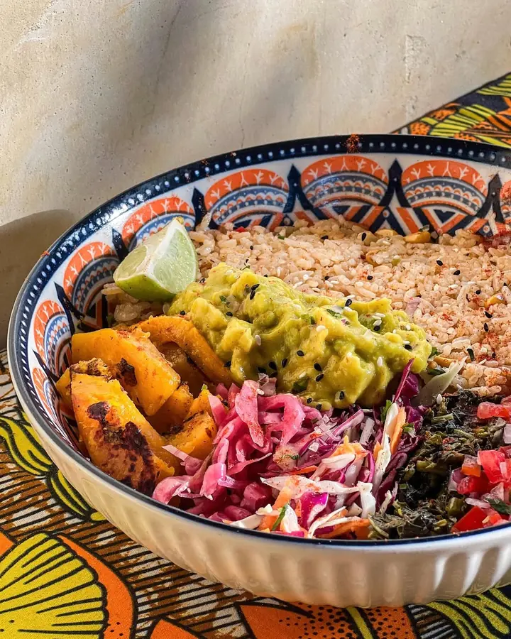 Veg rice bowl with roasted butternut squash, guacamole and slaw